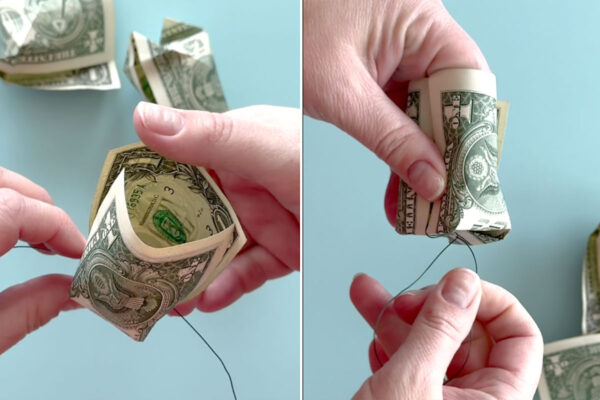 Putting floral wire across bottom of cup and twisting below.