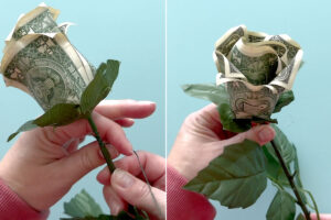 Twisting floral wire to secure rose to stem.