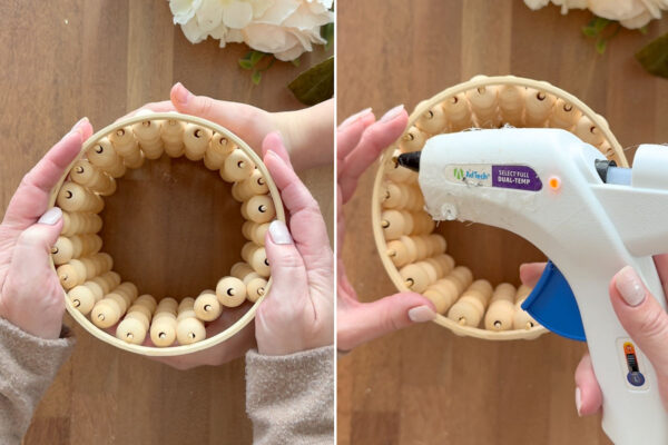 Gluing hoop to top of vase.