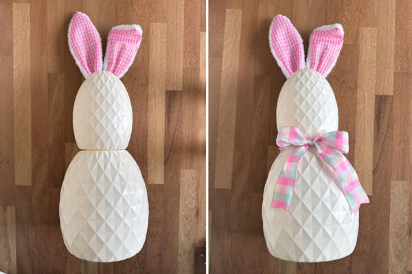 Putting small egg on middle one, bow tied around them.