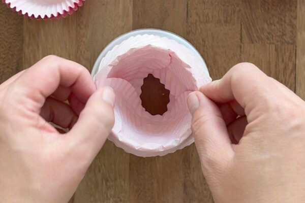 Layering a third cupcake liner.