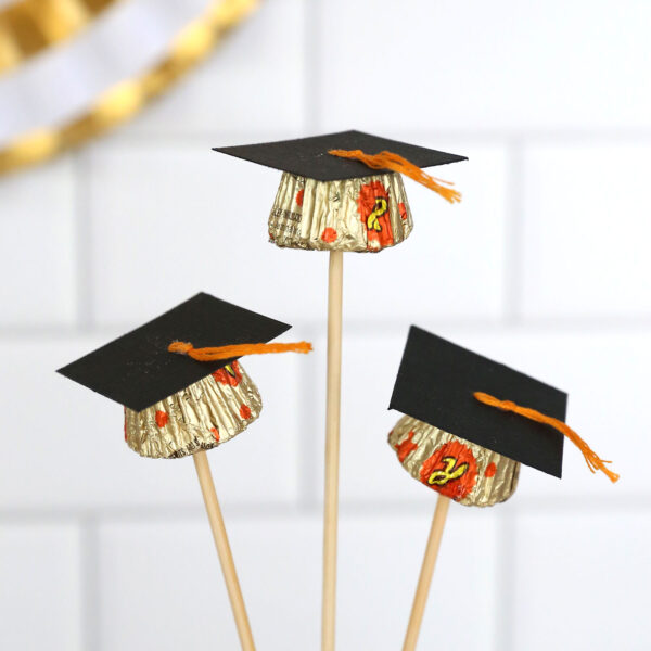 Graduation caps made from Reese's cups on skewers.