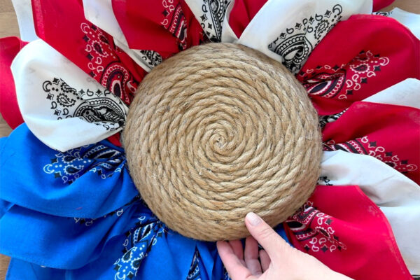 Gluing rope center to the wreath form.