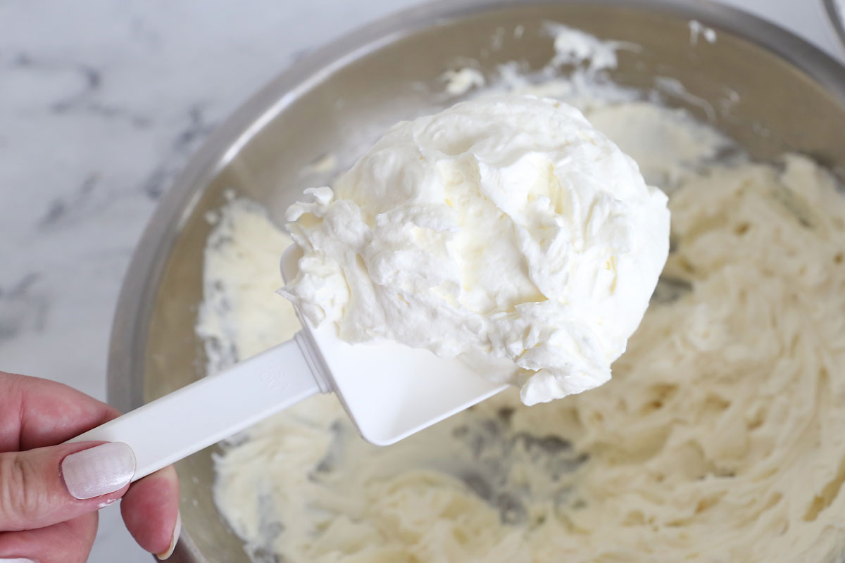 Mixing in whipped cream.