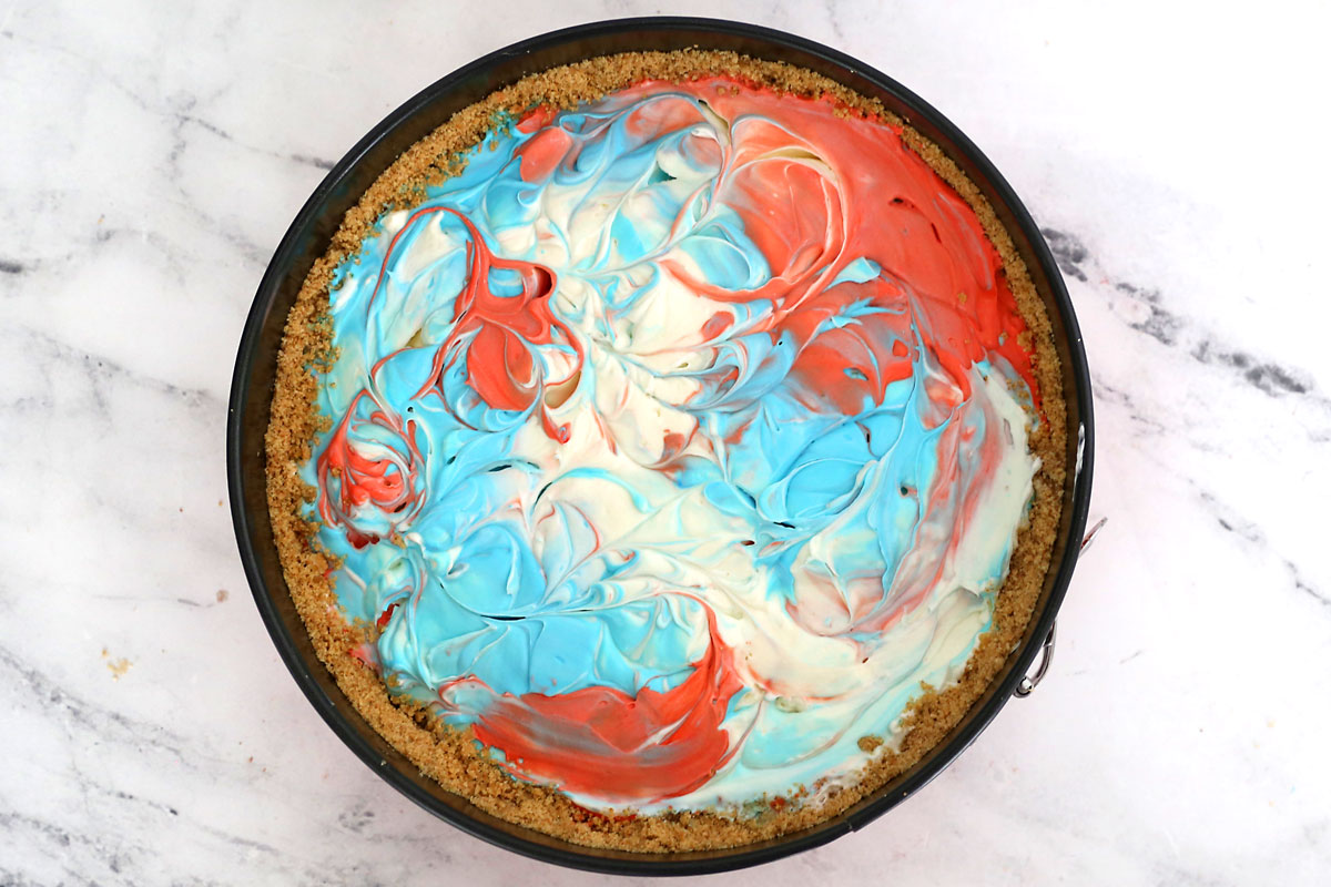 Cheesecake mix smoothed on top and swirled.