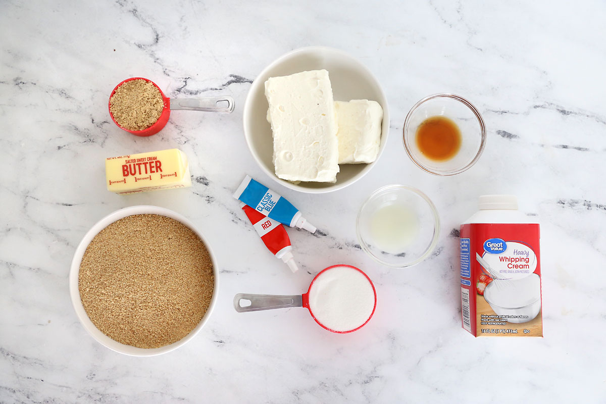 Ingredients: brown sugar, butter, graham cracker crumbs, cream cheese, sugar, vanilla, lemon juice, whipping cream, food coloring.