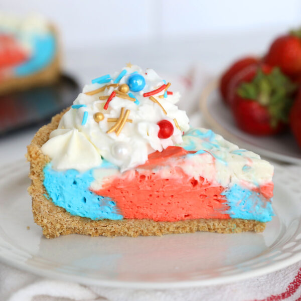 Slice of red, white and blue no bake cheesecake.