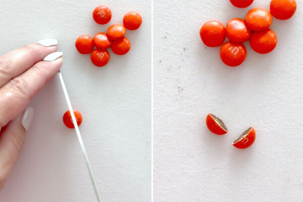 Slicing orange M&M in half.