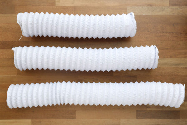 Dryer vent hose cut in three different lengths.