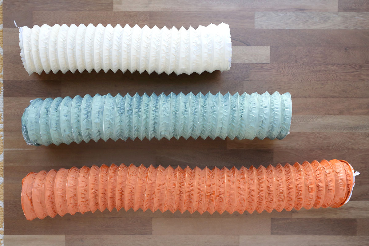 Dryer vent hose painted three different colors.