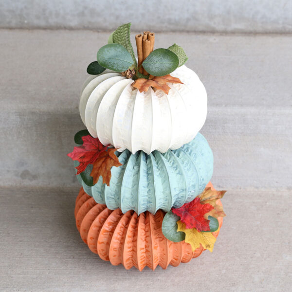 Pumpkin stack made from dryer vent hose.