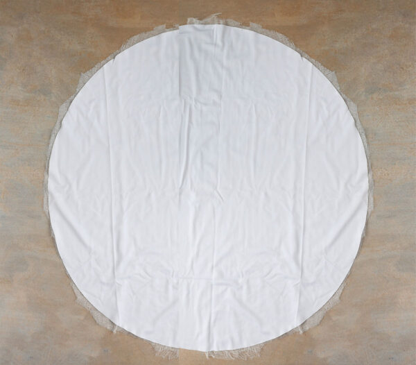 Cutting circle of cheesecloth.