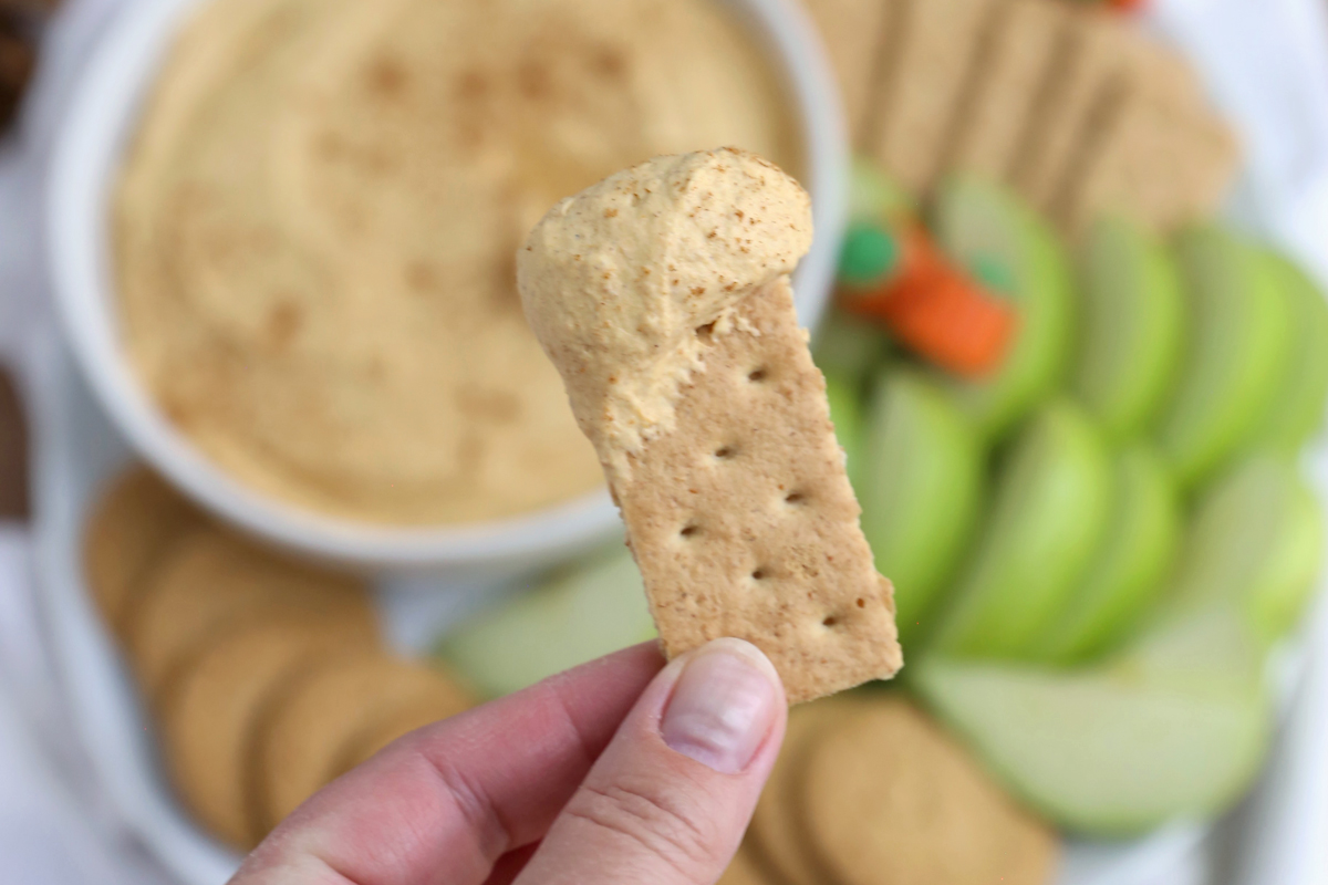 Graham cracker with pumpkin fluff on it.