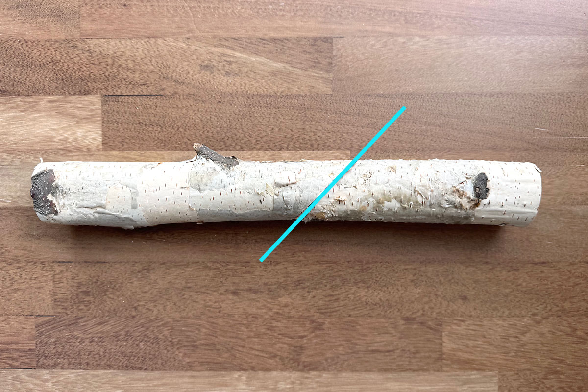 Cut the log at a 45 degree angle.