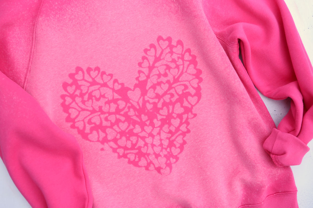 Sweatshirt beach dyed with heart design.