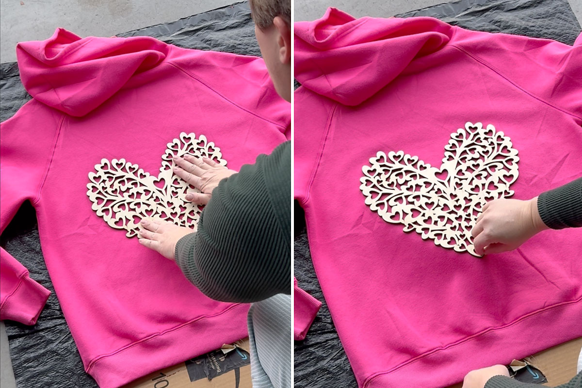Press the wood cutout heart down on the sweatshirt.