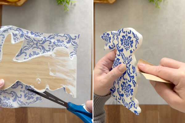 Cutting then sanding away excess napkin.