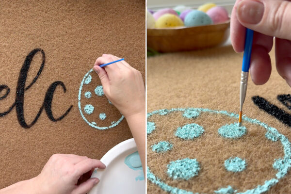 Touching up the design with small paintbrush.