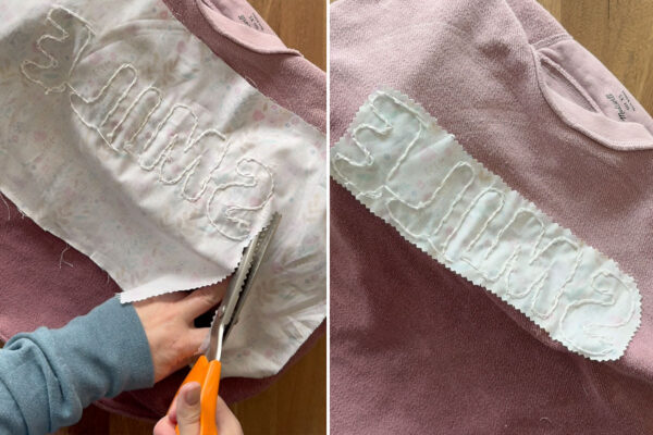 Cutting excess fabric from inside of sweatshirt with pinking shears.