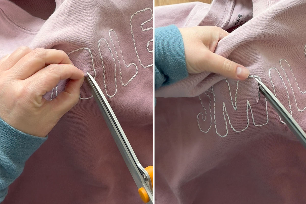 Carefully snip away fabric inside embroidery.