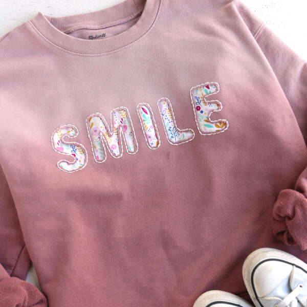 Reverse applique sweatshirt.