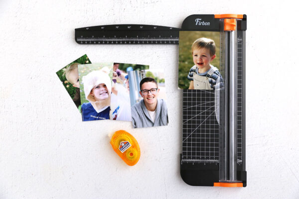 Using paper trimmer to cut photos to size.