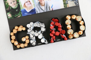 Candy filling the letters in the box.