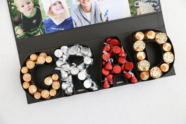 Candy filling the letters in the box.