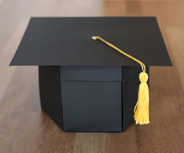 Box folded up to look like a graduation cap.