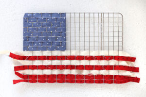 White and red stripes woven in below blue section.