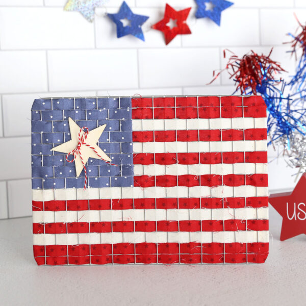 American flag made from cooling rack and fabric strips.