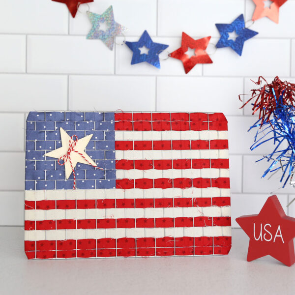American flag made from cooling rack and fabric strips.