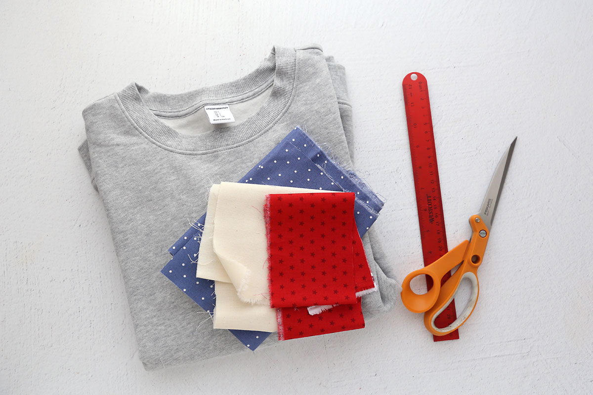 Fabric, sweatshirt, scissors, ruler.