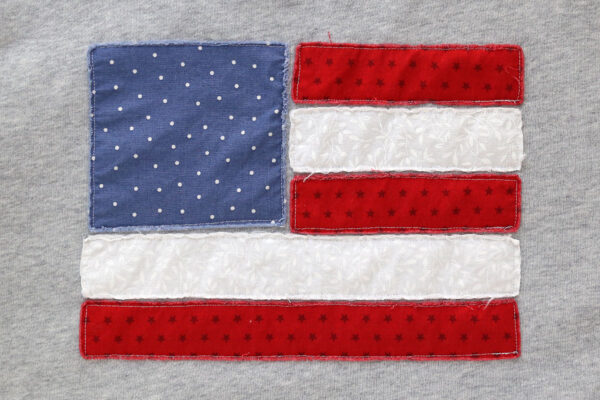 Flag design after washing with frayed edges.