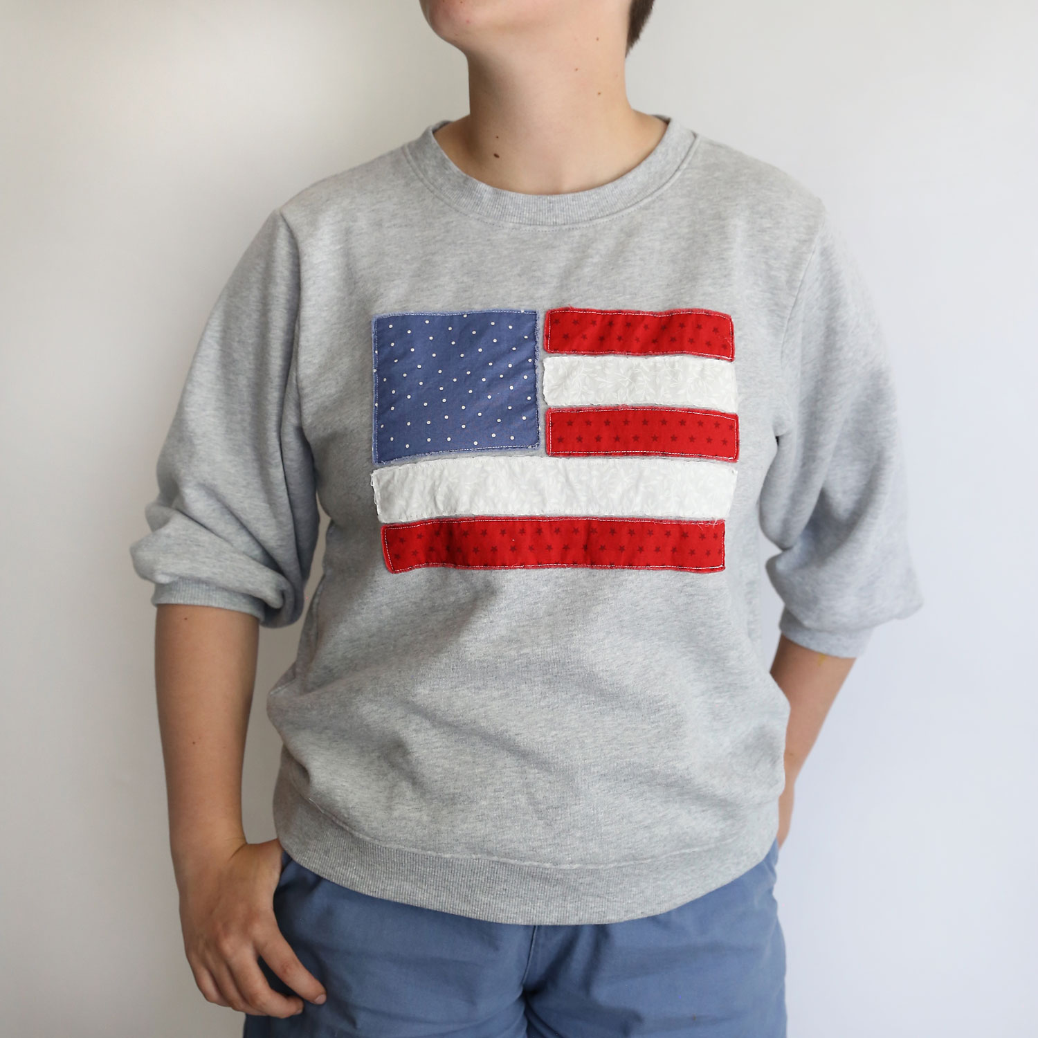 Sweatshirt with American flag applique.
