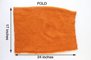 Fold fabric in half and sew down one long side to create tube.
