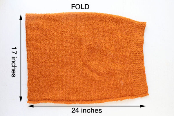 Fold fabric in half and sew down one long side to create tube.