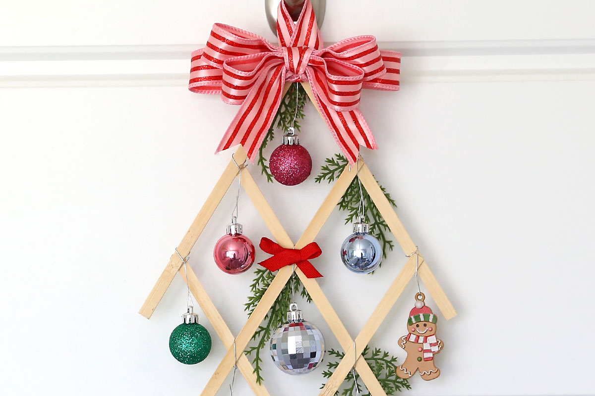 Closeup of decorated Christmas tree wall hanging decor.